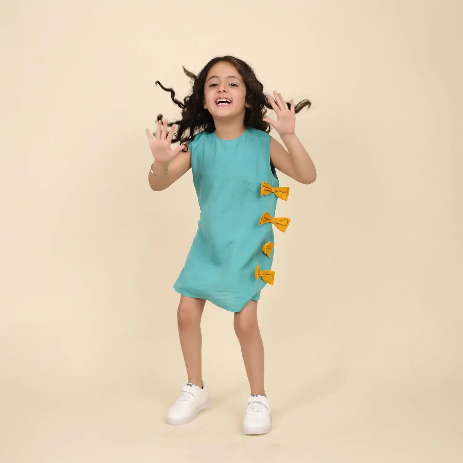 Sleeveless Teel blue linen Tunic with Mustard Bow Detail